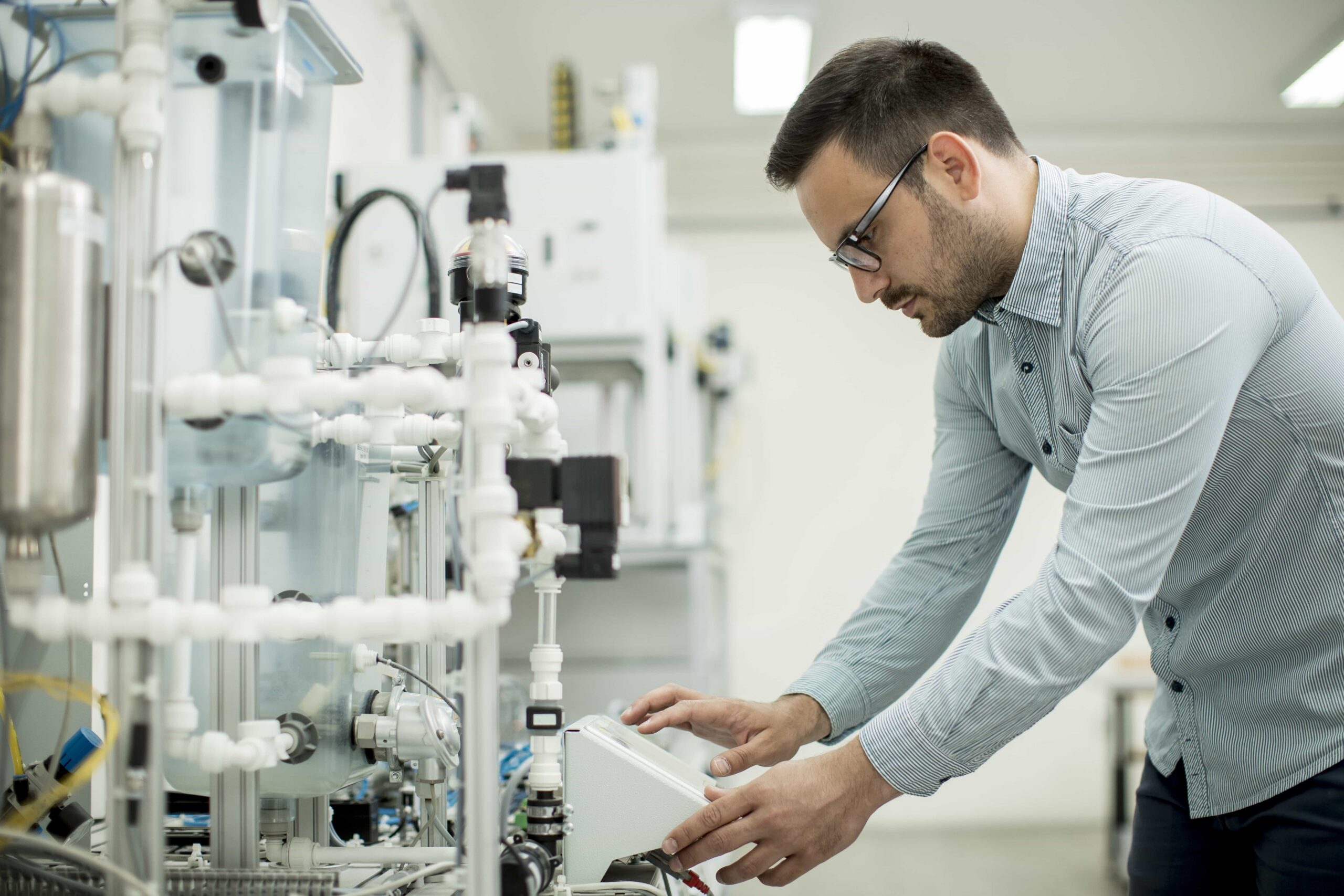 Technician looking at clean sample water